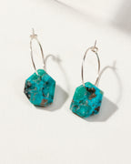 Sterling Silver Geometry Mini Hoops with Turquoise gemstones on a white surface.
