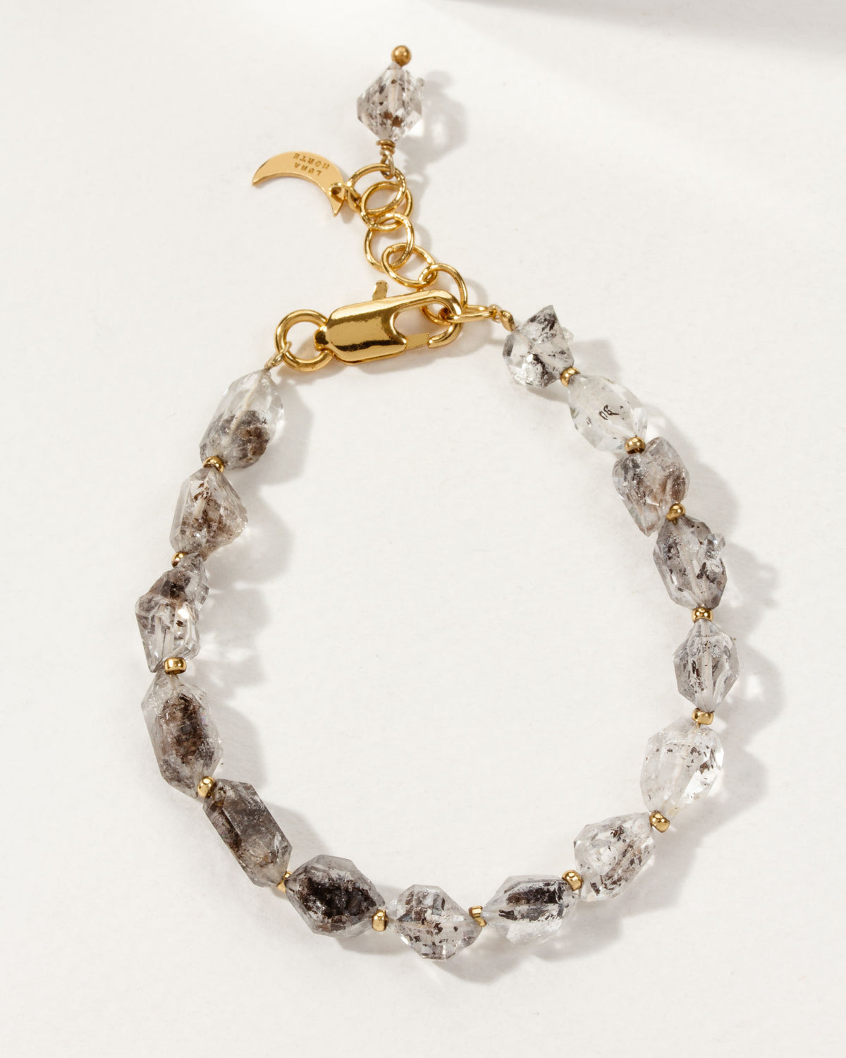 Unearthed bracelet of Herkimer Quartz with 14KT Gold Plated Brass accents.