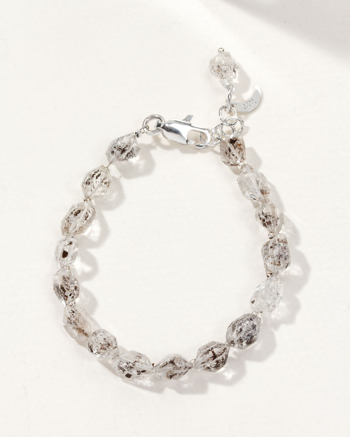 Silver plated brass bracelet with Herkimer Quartz gemstones.