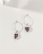 Sterling silver mini hoop earrings with a raw Herkimer Quartz "diamond" charm.