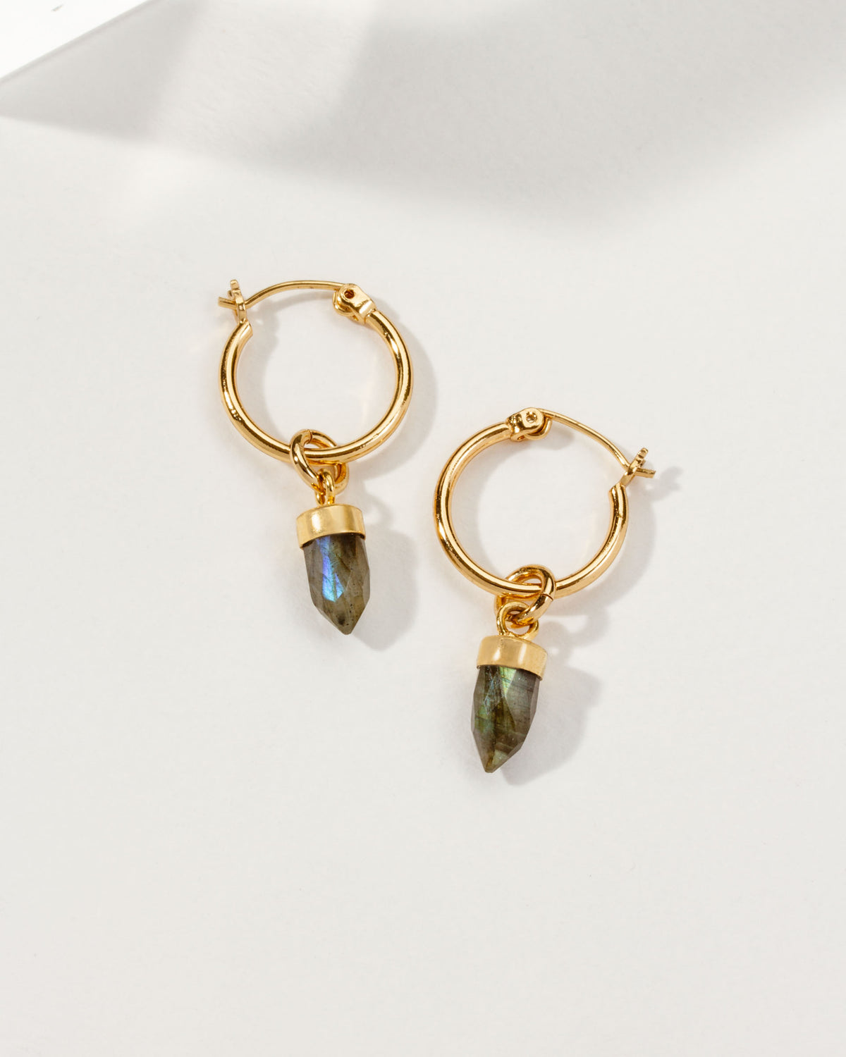 Pair of gold mini hoop earrings with Labradorite stone pendants.