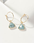 Pair of gold mini hoop earrings with aquamarine triangle stones.
