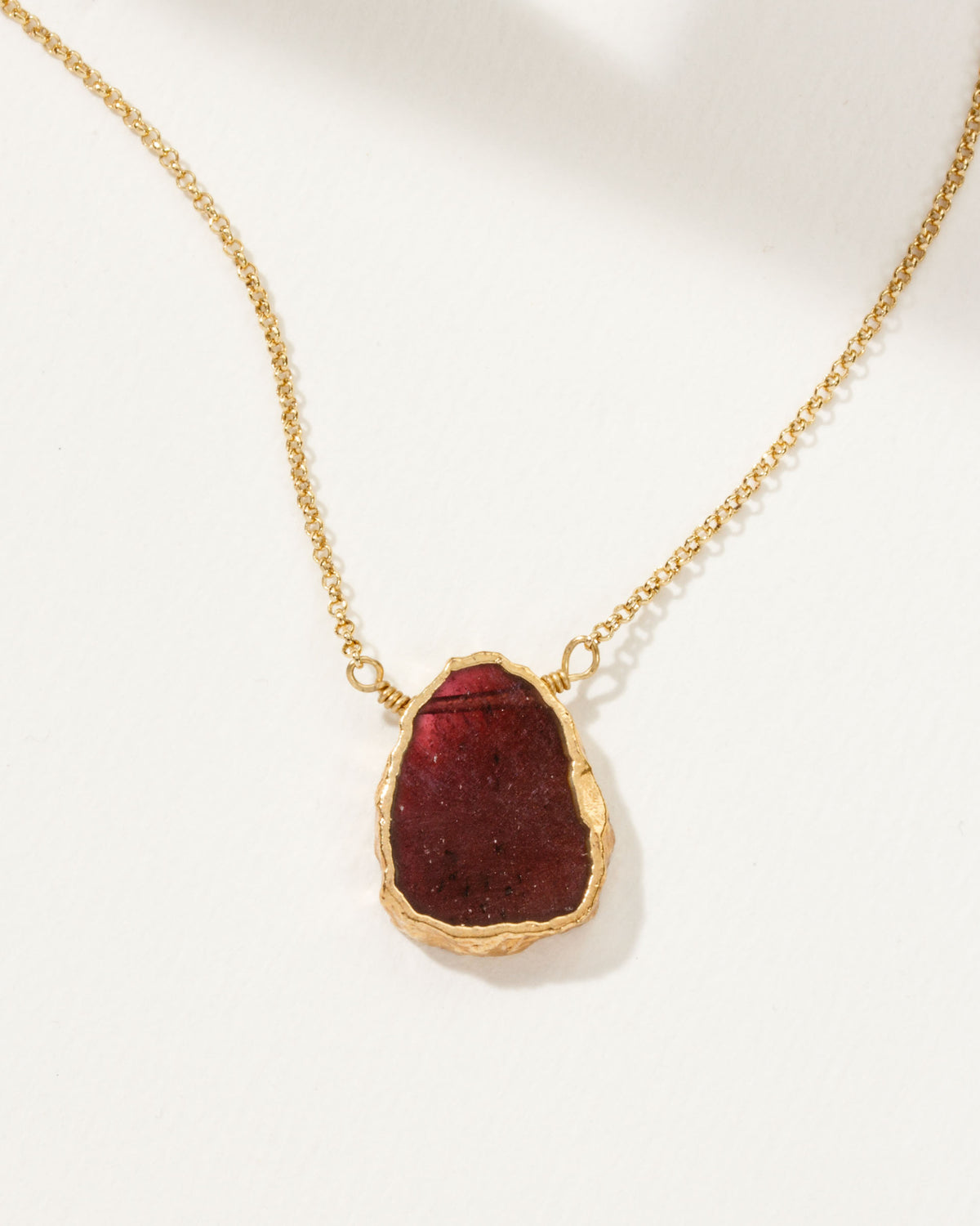 Garnet Earth, Wind, and Fire Necklace with gold plated chain.
