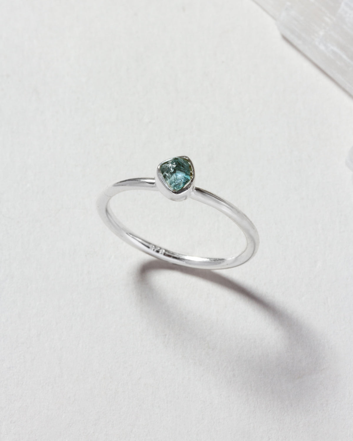Silver ring featuring a genuine aquamarine gemstone.