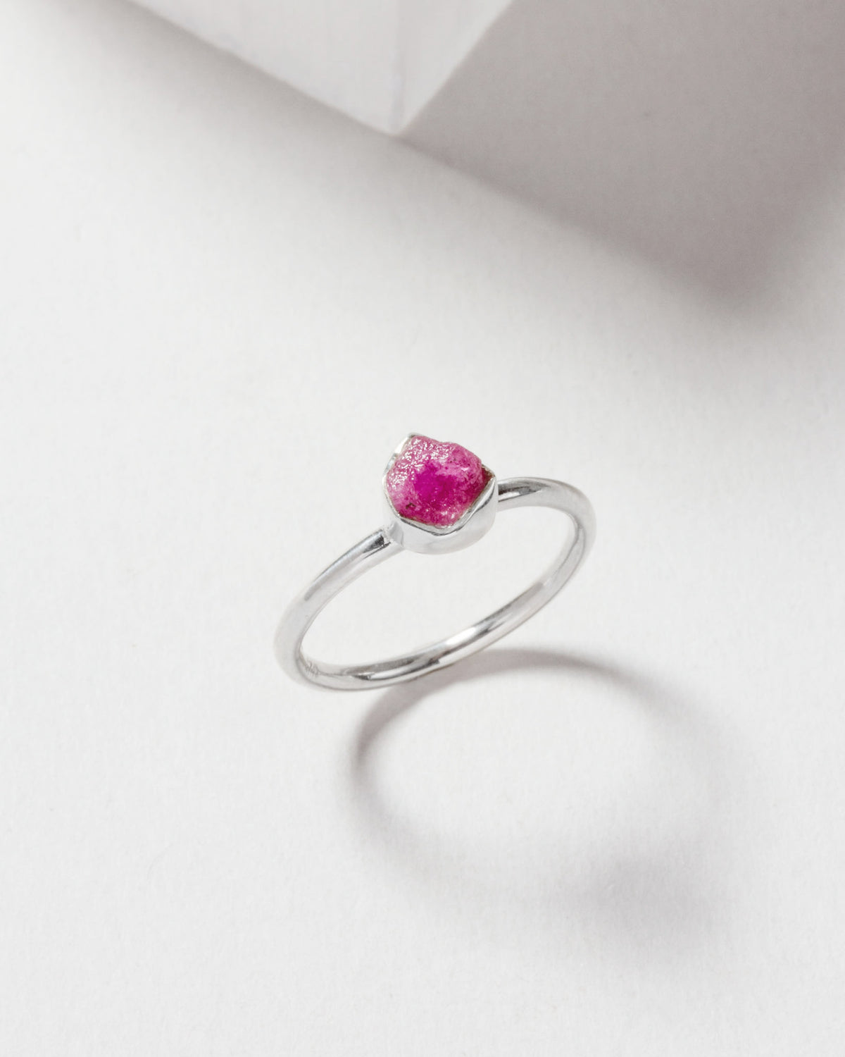Silver ring featuring a genuine ruby stone.
