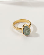 Gold ring featuring an Aurora Borealis labradorite gemstone.