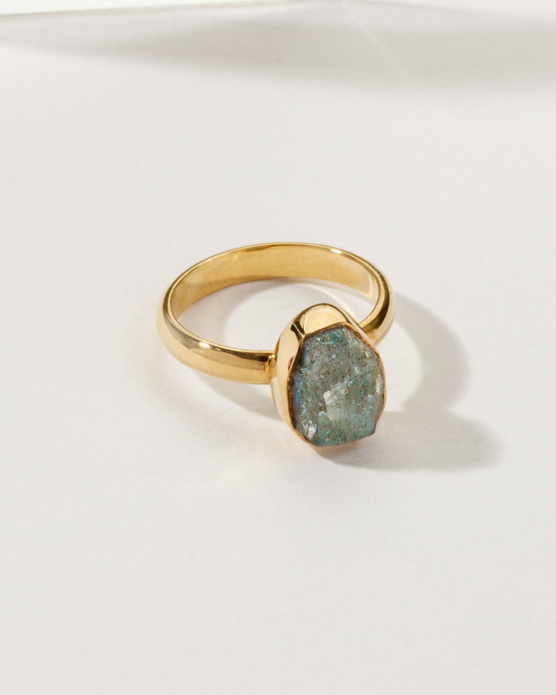 Gold ring featuring an Aurora Borealis labradorite gemstone.
