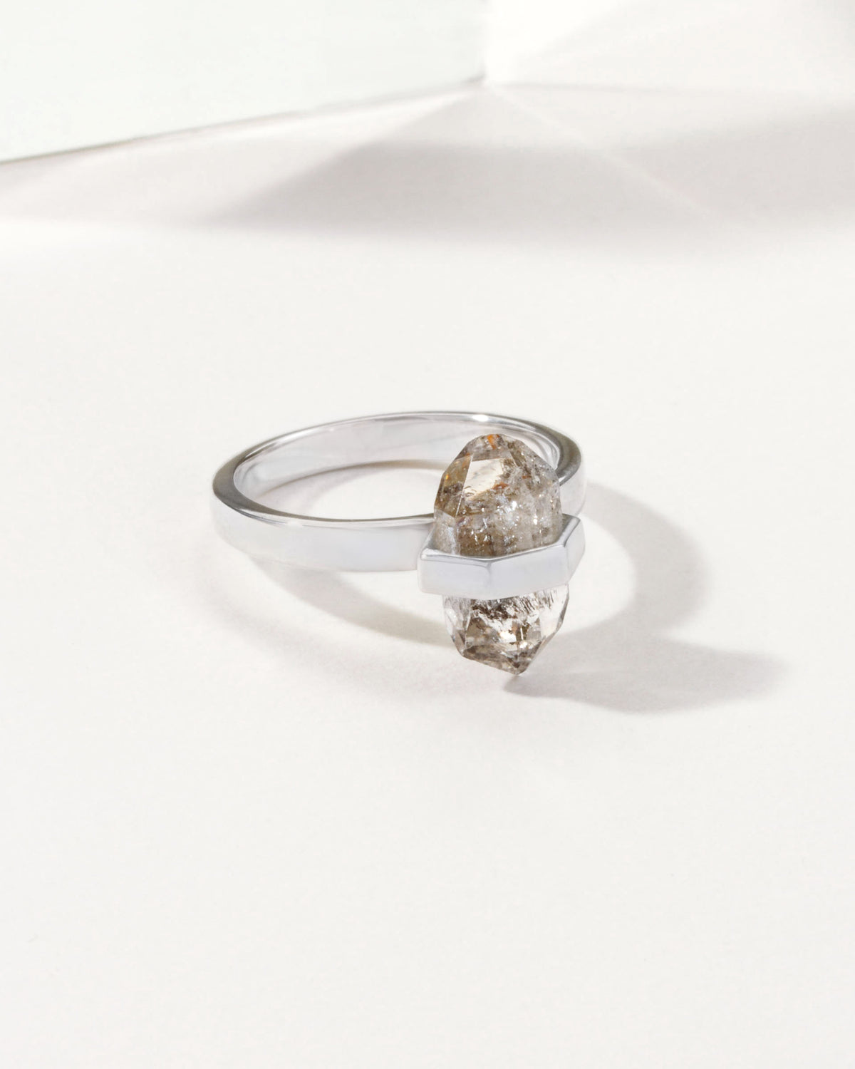 Sterling silver ring featuring a clear Herkimer Quartz crystal.