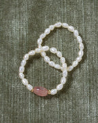 Two Coastal Stretch Rings: one with Freshwater Pearls and one with Strawberry Quartz.