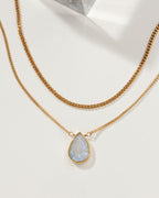 Daily Necklace Set with gold chains and a Moonstone pendant.