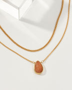 Daily Necklace Set with a Sunstone pendant and a gold chain.