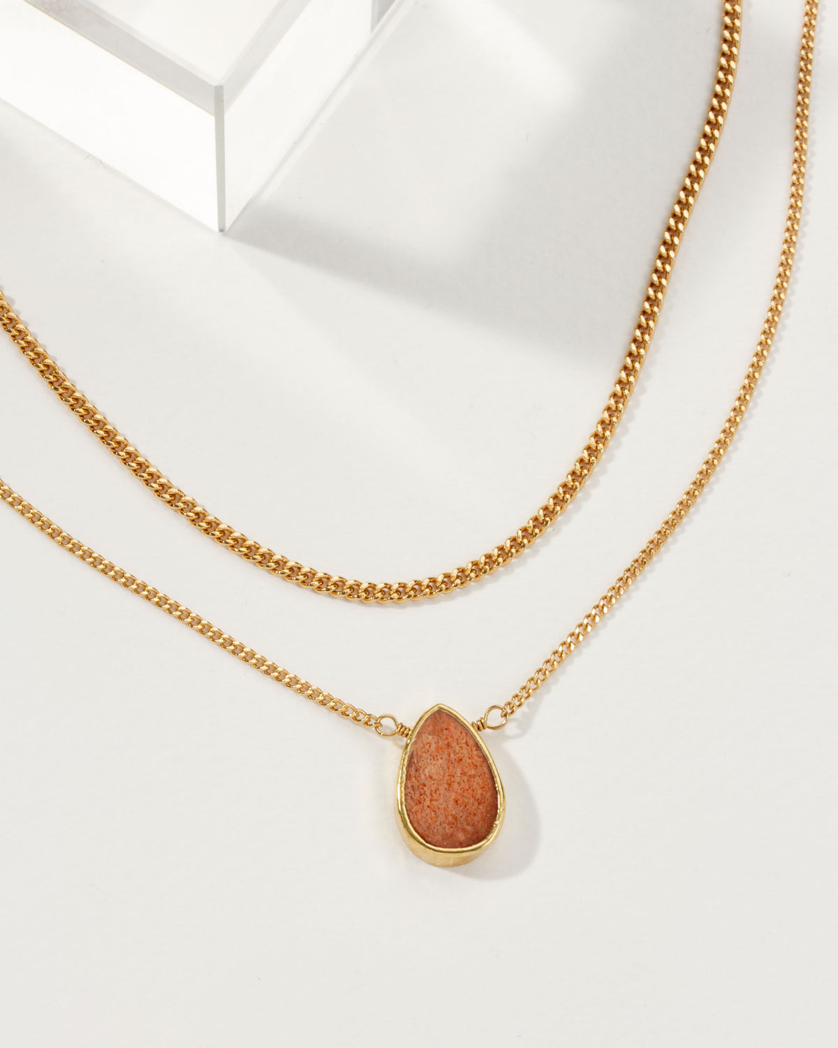 Daily Necklace Set with a Sunstone pendant and a gold chain.