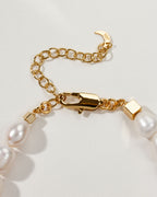 Close up of the gold chain and Mother of Pearl beads on the Royal Necklace.