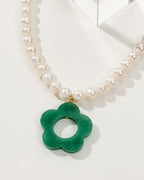 Oops-A-Daisy necklace with pearls and a Green Aventurine pendant in the shape of a flower.