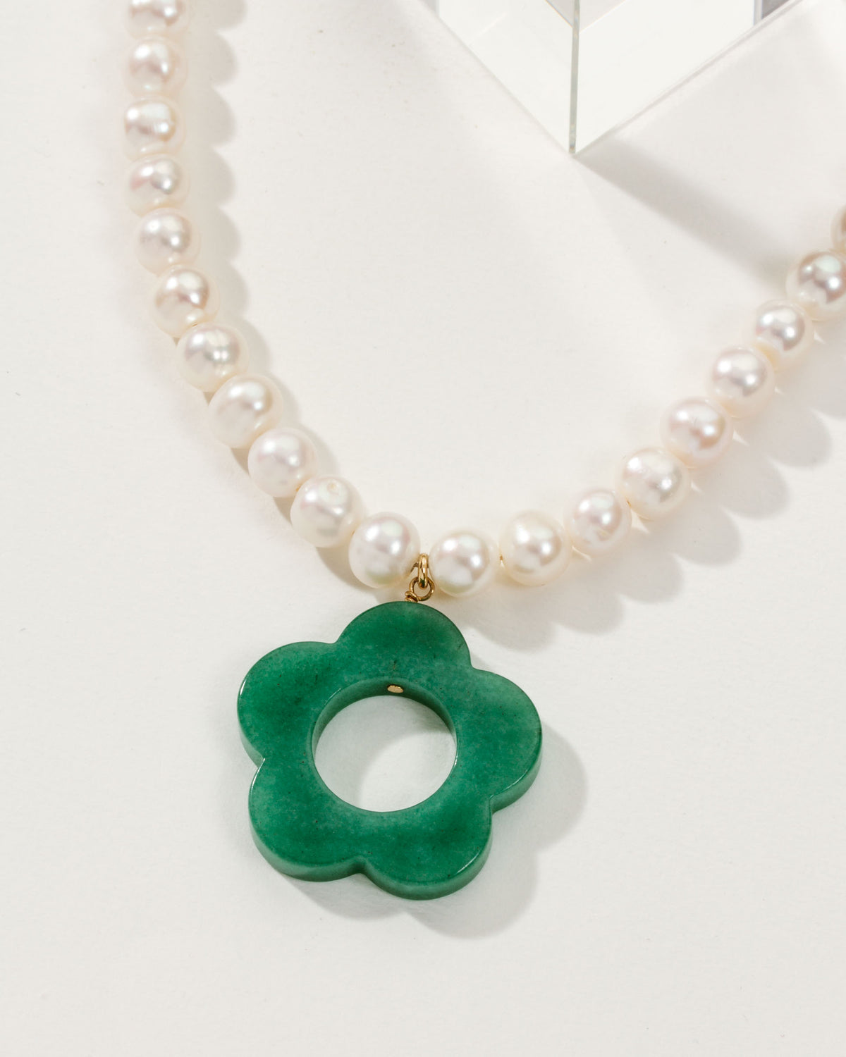 Oops-A-Daisy necklace with pearls and a Green Aventurine pendant in the shape of a flower.