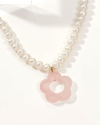 Oops-A-Daisy Necklace with a pearl chain and a Rose Quartz flower pendant.