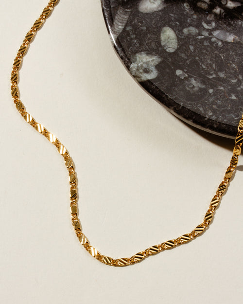 Adorned Toggle Necklace in gold with a unique link design