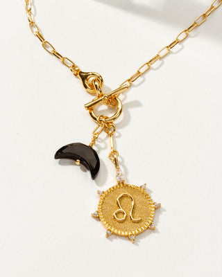 Leo Zodiac symbol gold plated toggle necklace with Onyx crescent moon by Luna Norte