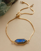 Northern Lights Adjustable Bracelet with a Labradorite stone on a gold chain.