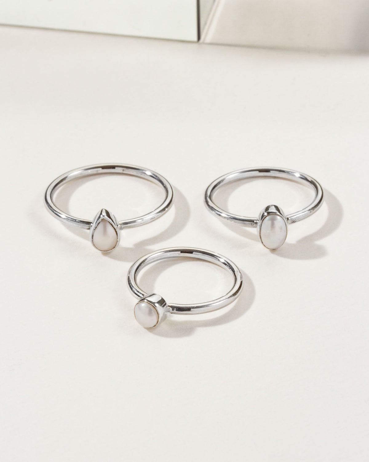 Three Sand to Stone Freshwater Pearl Rings: Teardrop, Oval and Round.