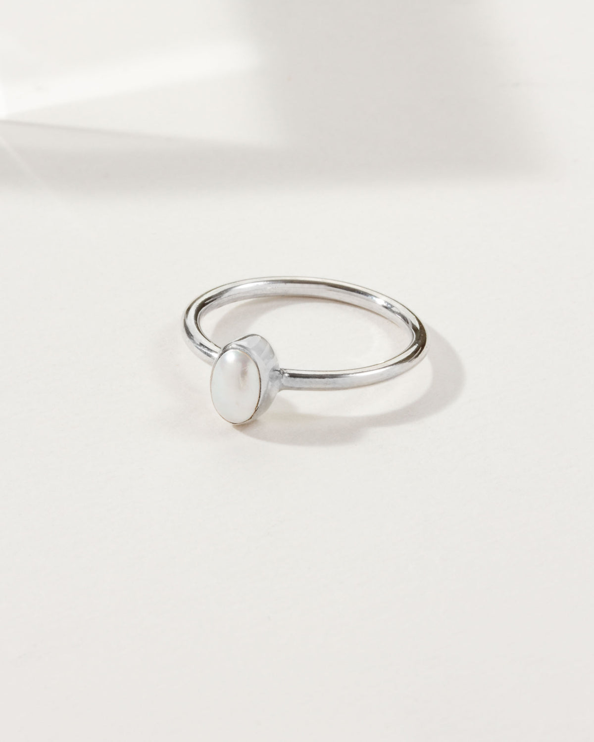 Sand to Stone ring with an oval freshwater pearl on a silver band.