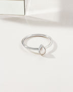 Silver ring with a teardrop freshwater pearl.