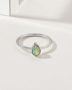 Sterling silver ring with a teardrop opal gemstone.