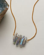 Rainy Day necklace with blue crystal points and gold chain.