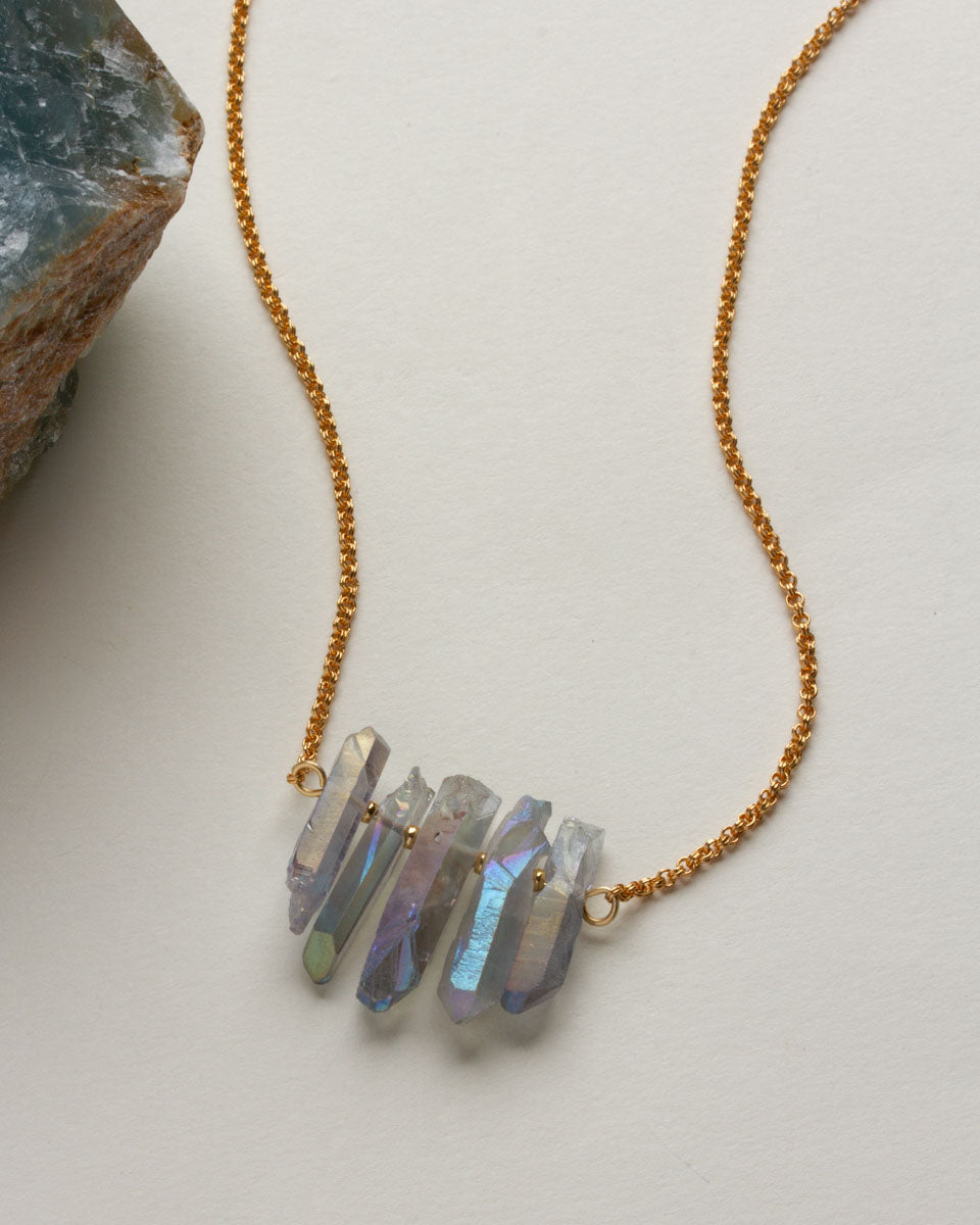 Rainy Day necklace with blue crystal points and gold chain.