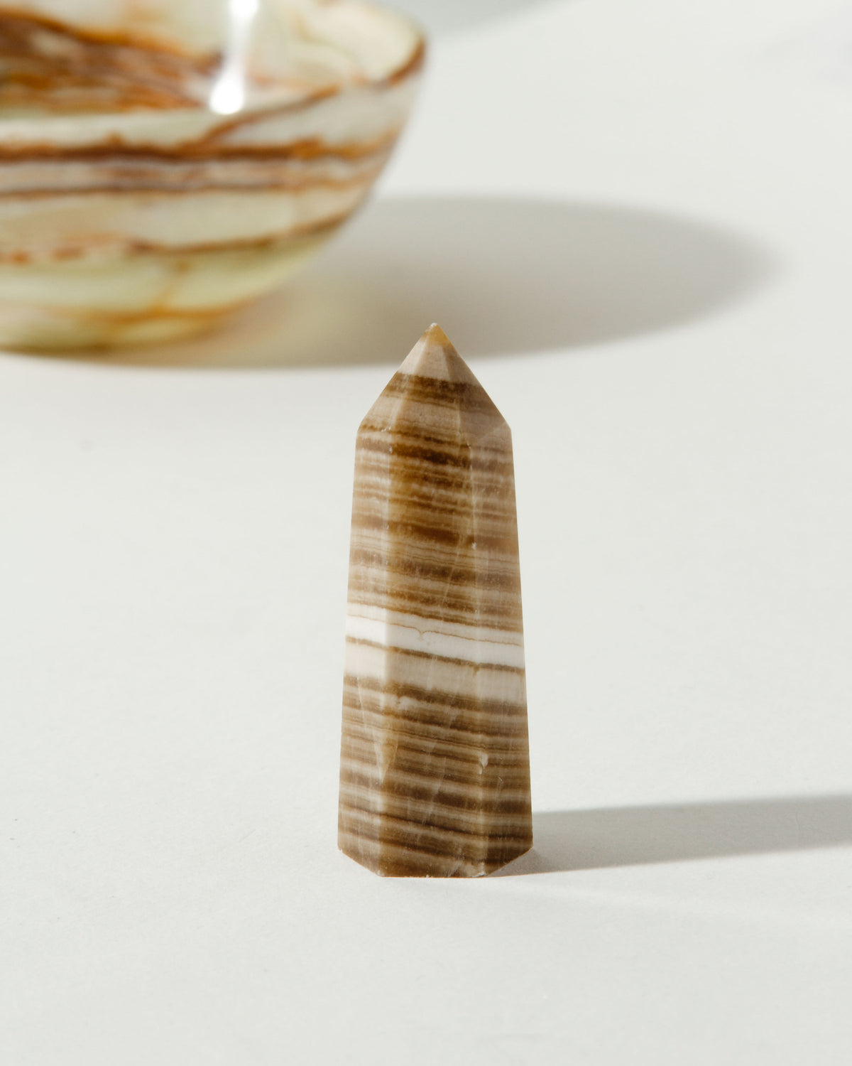 Beige Amplify Calcite Gemstone Mini Tower with horizontal stripes.