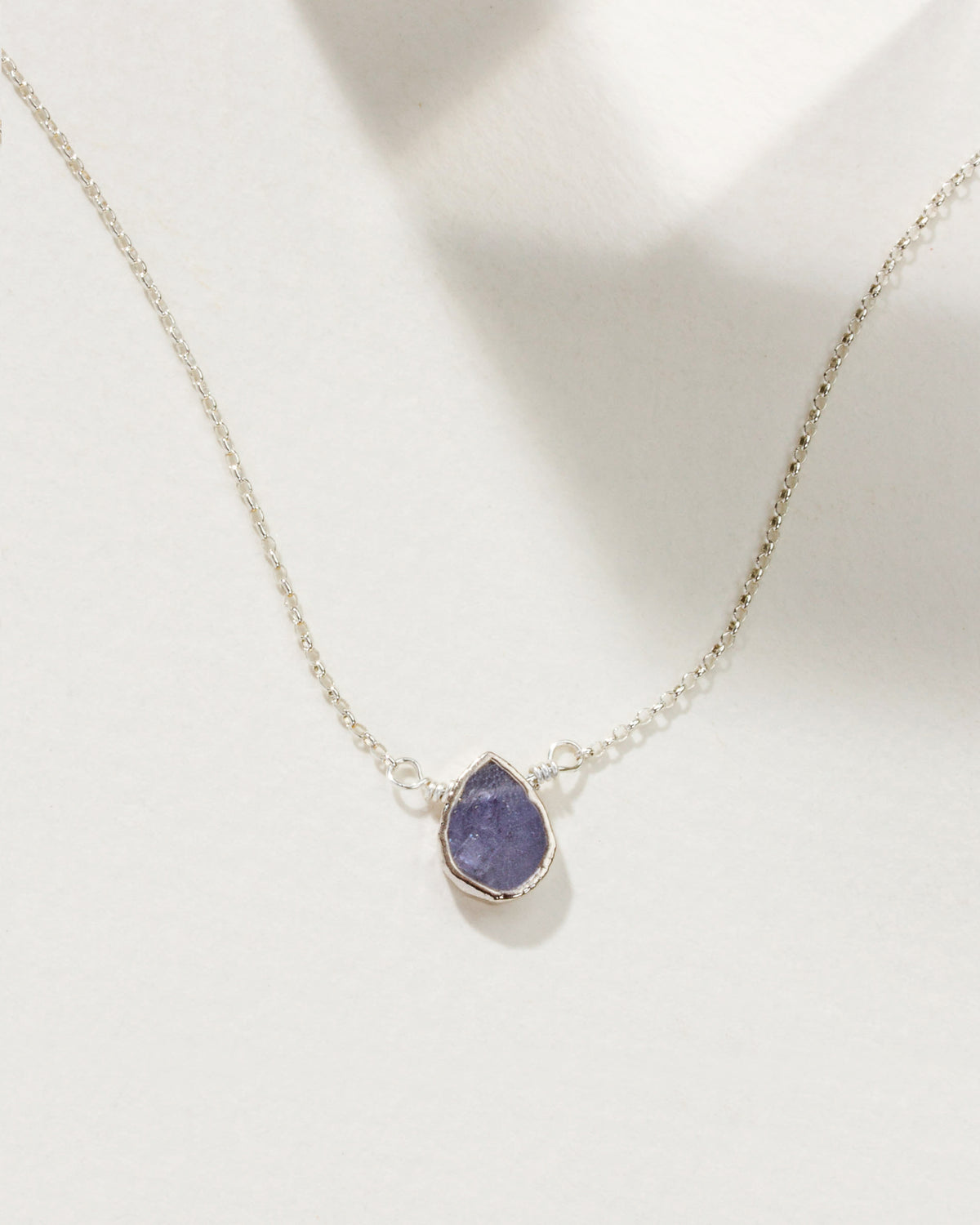 Silver plated brass necklace with a teardrop December-Tanzanite gemstone.