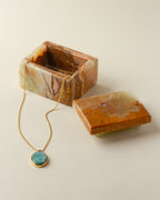 Open natural Calcite jewelry box with brown and green swirls