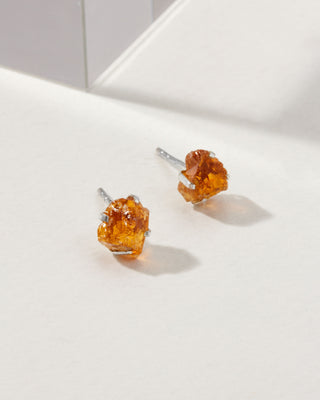 Citrine Raw Beauty Birthstone Post Earrings on a white tabletop