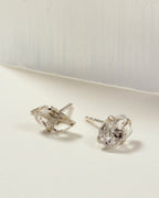 Herkimer Quartz Raw Beauty Birthstone Post Earrings on a white tabletop