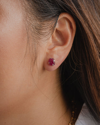 Close up of model wearing Ruby Peridot Raw Beauty Birthstone Post Earrings.