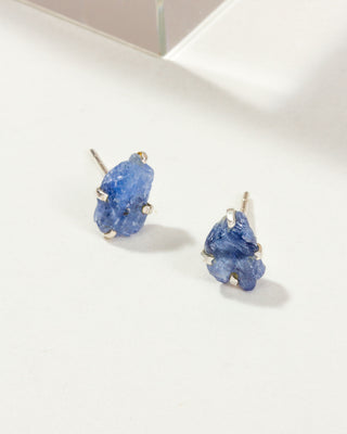 Sapphire Raw Beauty Birthstone Post Earrings on a white tabletop