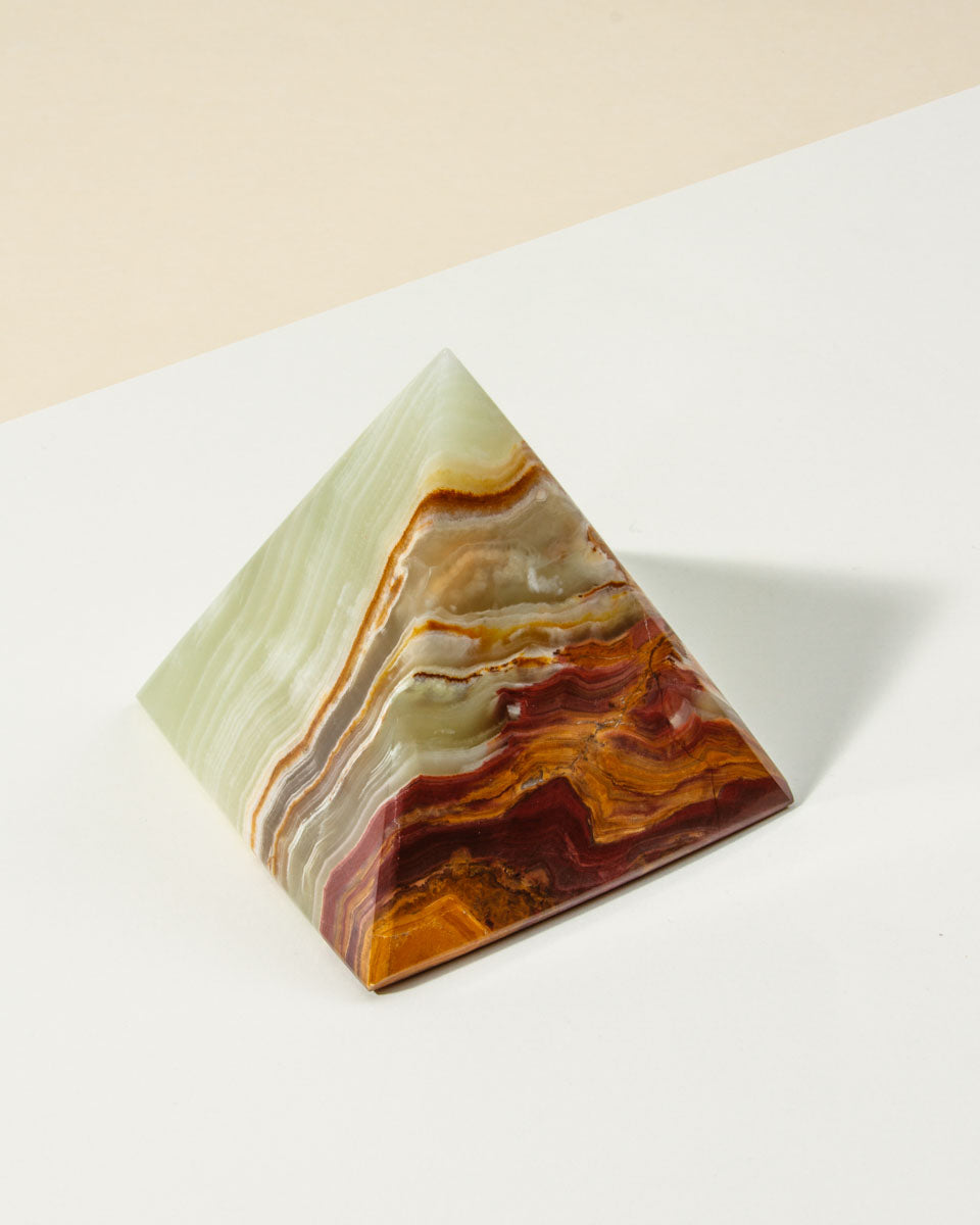 Banded Calcite pyramid in greens, browns, oranges and cream.